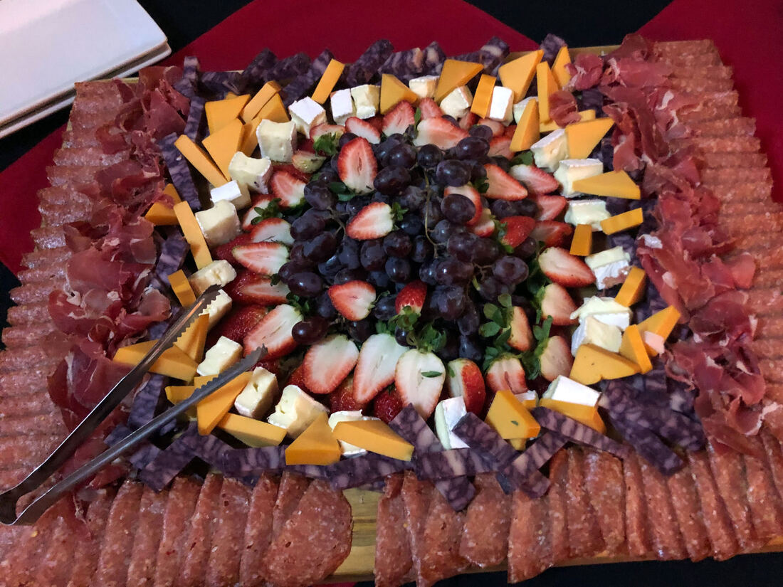 Charcuterie board with cured meats, cheese and pickled vegetables